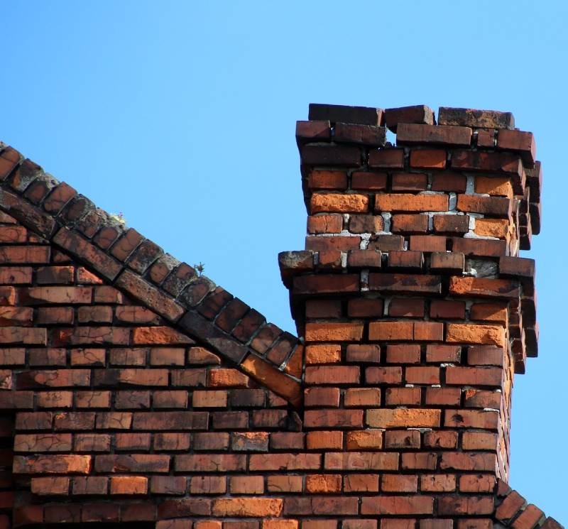 Damaged chimney on an Adelphi home showing cracks and missing mortar
